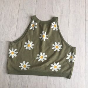 A green daisy crop top